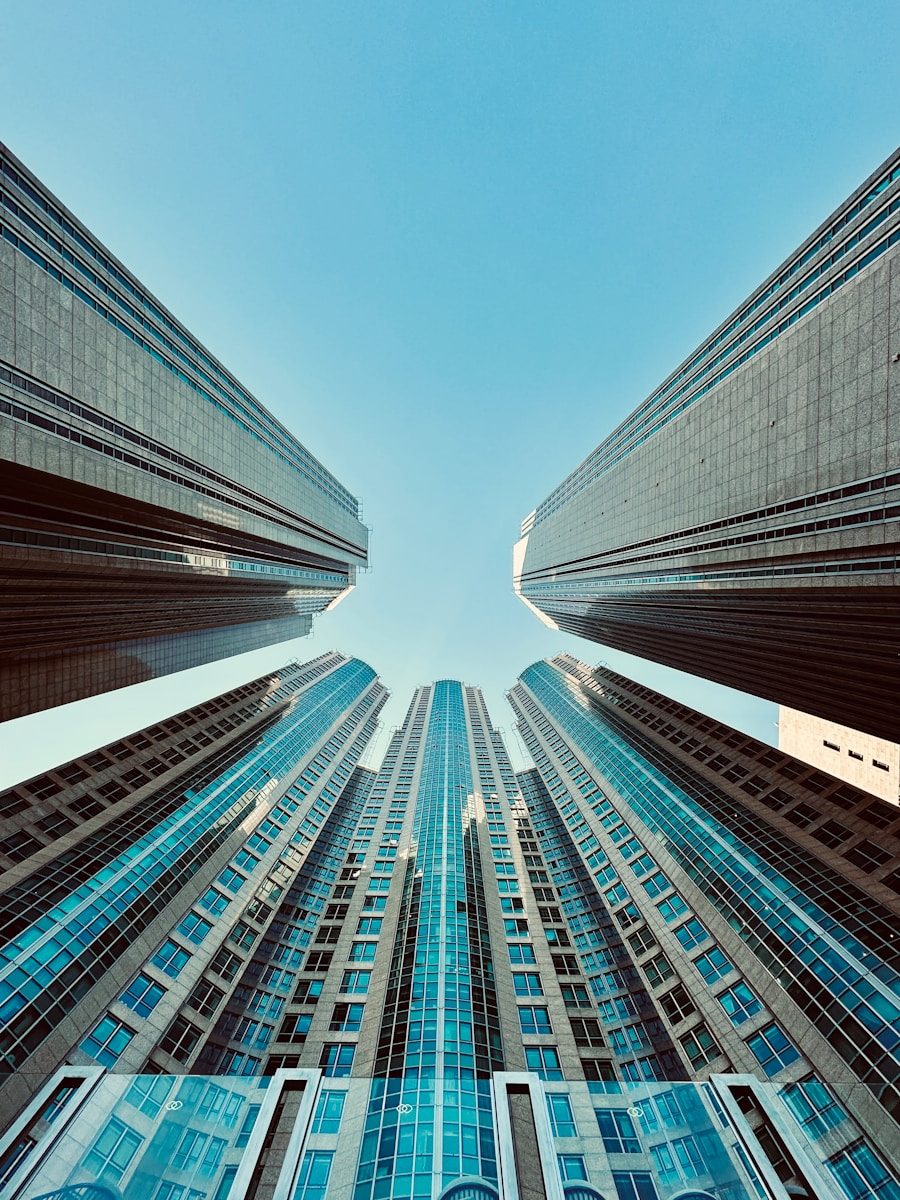looking up at tall buildings in a city